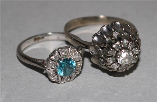 An 18ct white gold and diamond cluster ring and a white gold, blue zircon and diamond cluster ring.